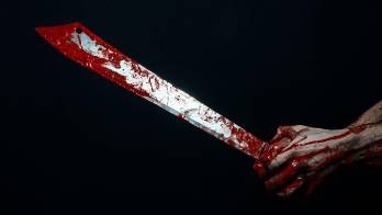 Bloody hands with a machete zombie demon maniac knife