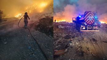 El vertedero aún se mantiene incendiado.