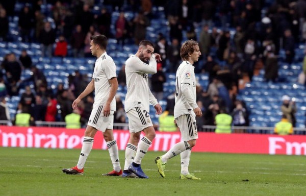 Sergio Reguilón, Dani Carvajal y Luka Modric incrédulos.