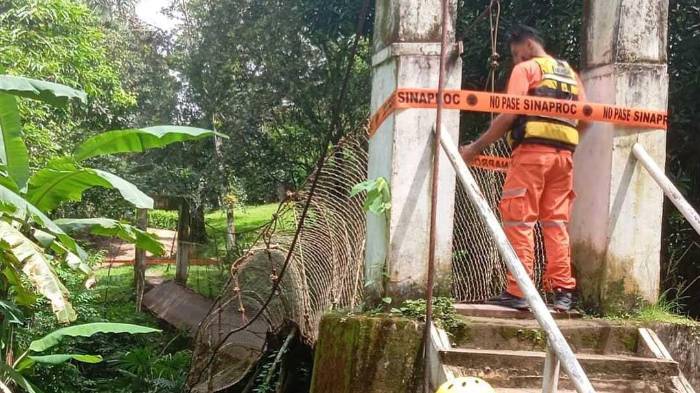 Autoridades colocan cinta de seguridad tras el colapso del puente en Turega, Coclé, que dejó seis personas heridas.