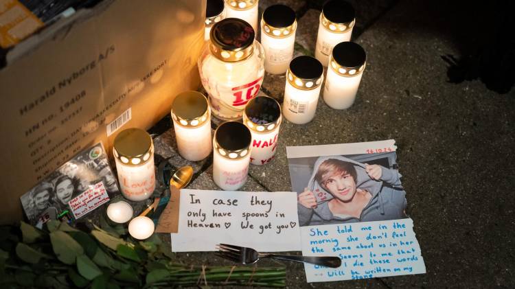 Candles and flowers have been placed at a makeshift memorial in tribute to late British singer and former member of boy band One Direction, Liam Payne at the Forum in Copenhagen, Denmark on October 17, 2024. Payne, 31, died after falling from a third-floor balcony at a Buenos Aires hotel on Wednesday, October 16. The circumstances of the pop star's death, however, remain unclear. (Photo by Emil Nicolai Helms / Ritzau Scanpix / AFP) / Denmark OUT